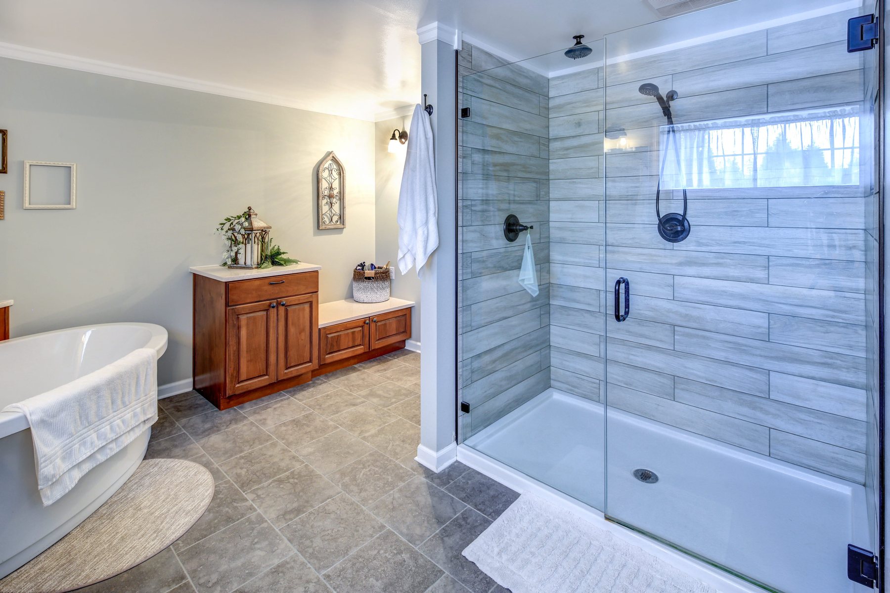 Refreshed bathroom with glass shower and soaking tub