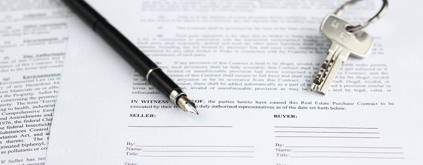 House keys and a pen on home ownership documents