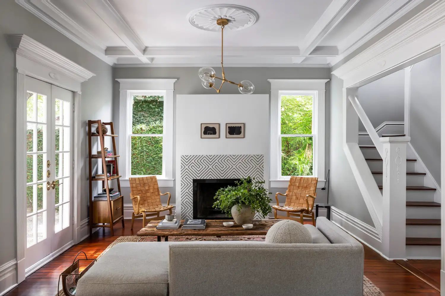 Warm, light-filled living room with thoughtful furnishings and wood floors